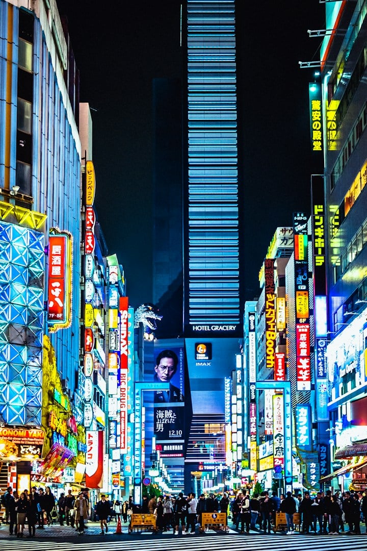 Shibuya scramble crossing at night with neon signs